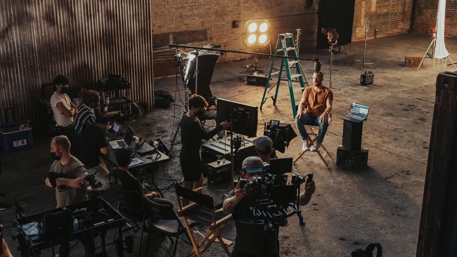 Film crew gathered around a camera setup on a shoot
