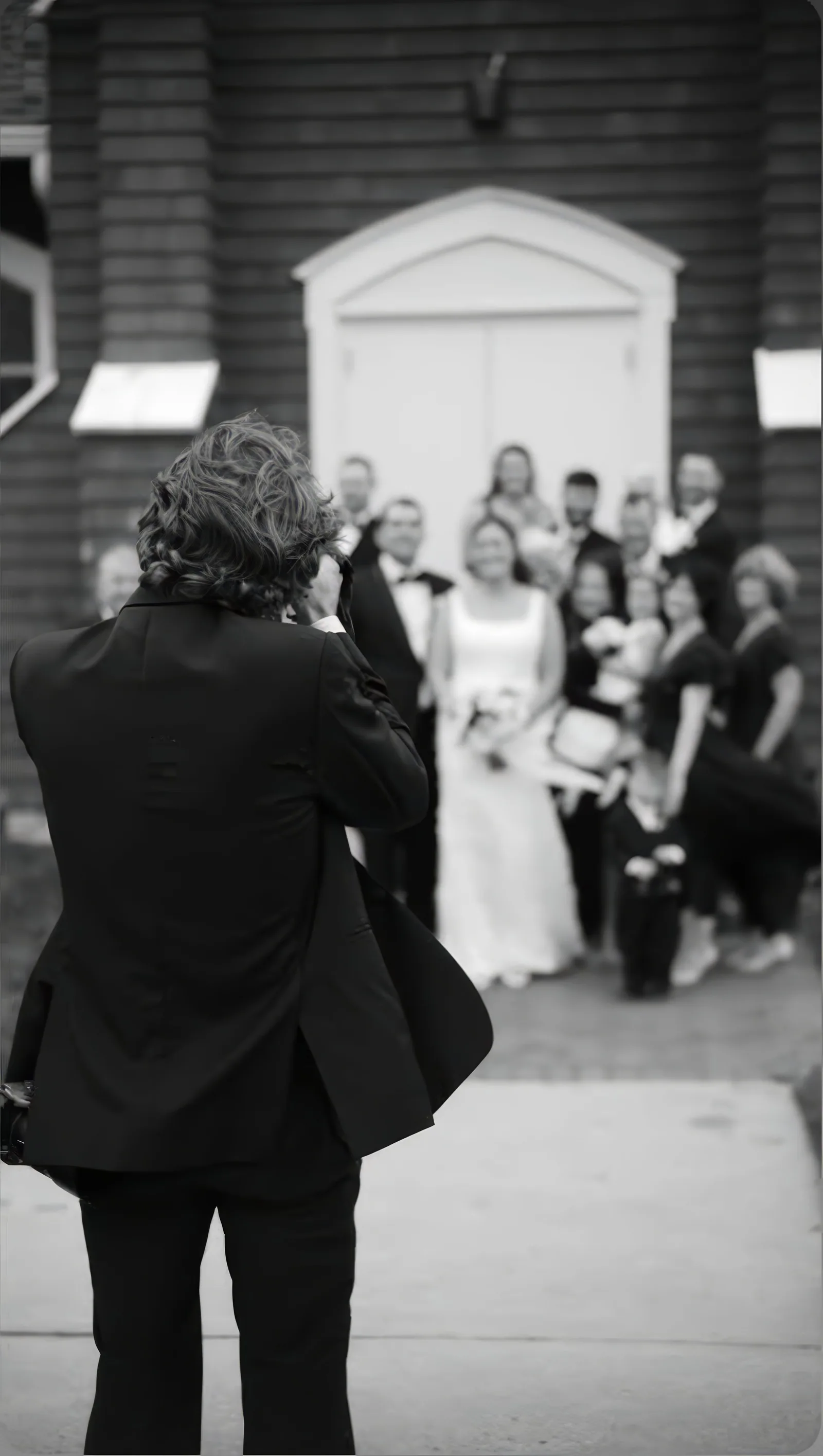 Michael Justin photographing a wedding party