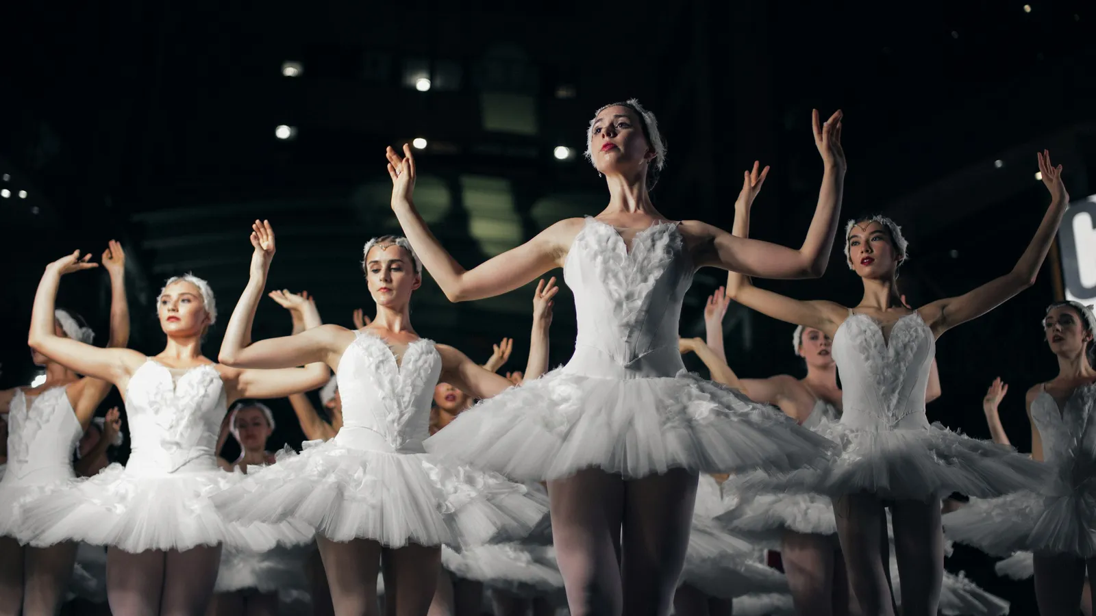 Dancers performing on a stage during a recital